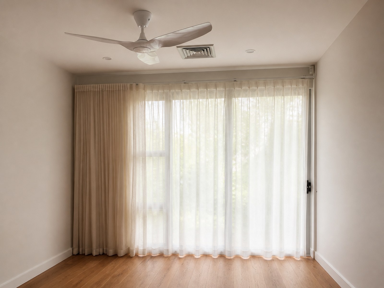 Sheer curtains in a neutral living room